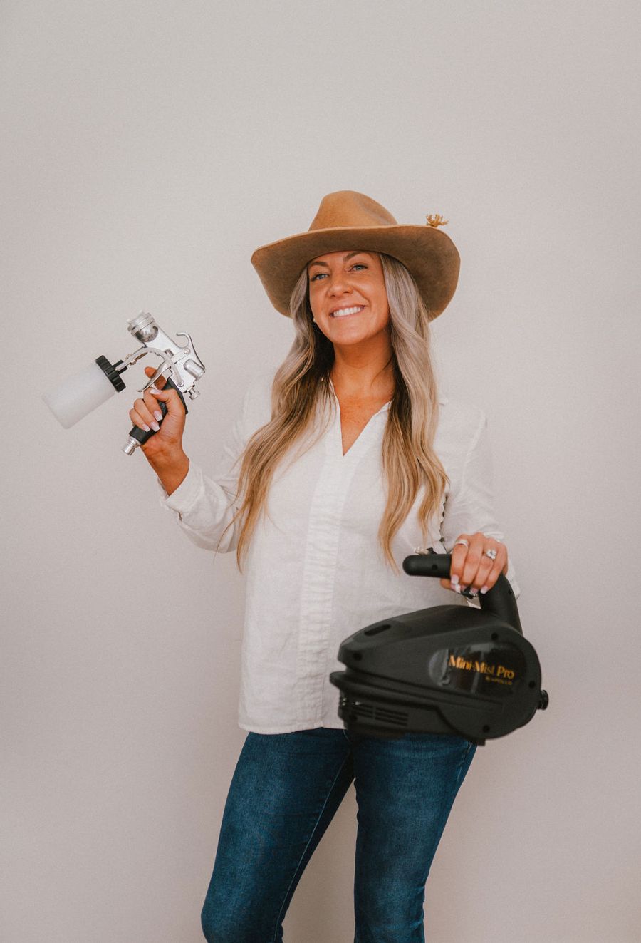 A certified spray tan artist after completing NSTPA training